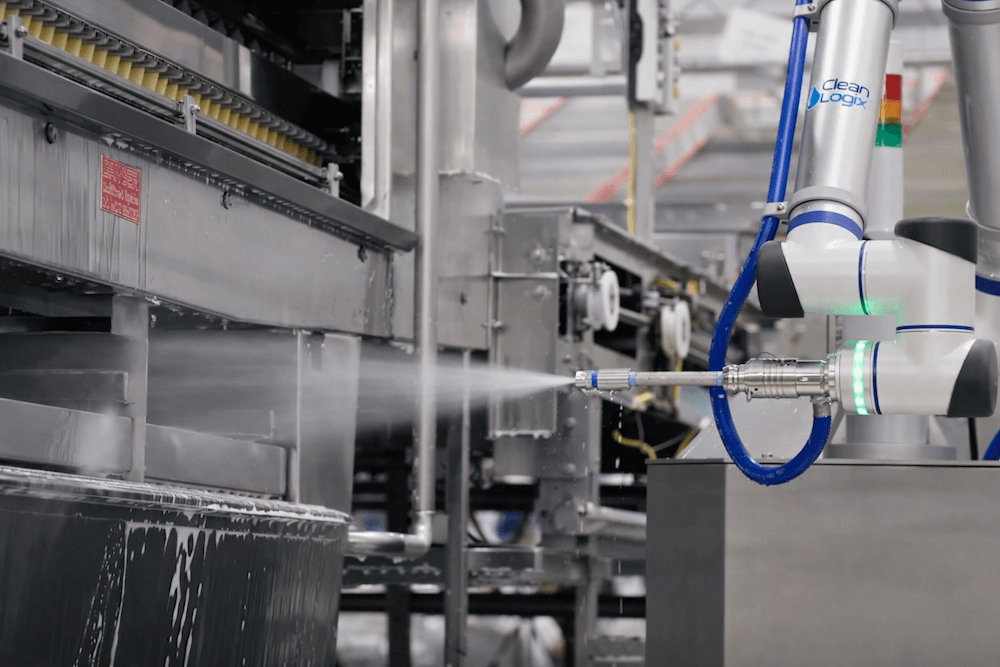 Robotic cleaning system operating in a food processing plant