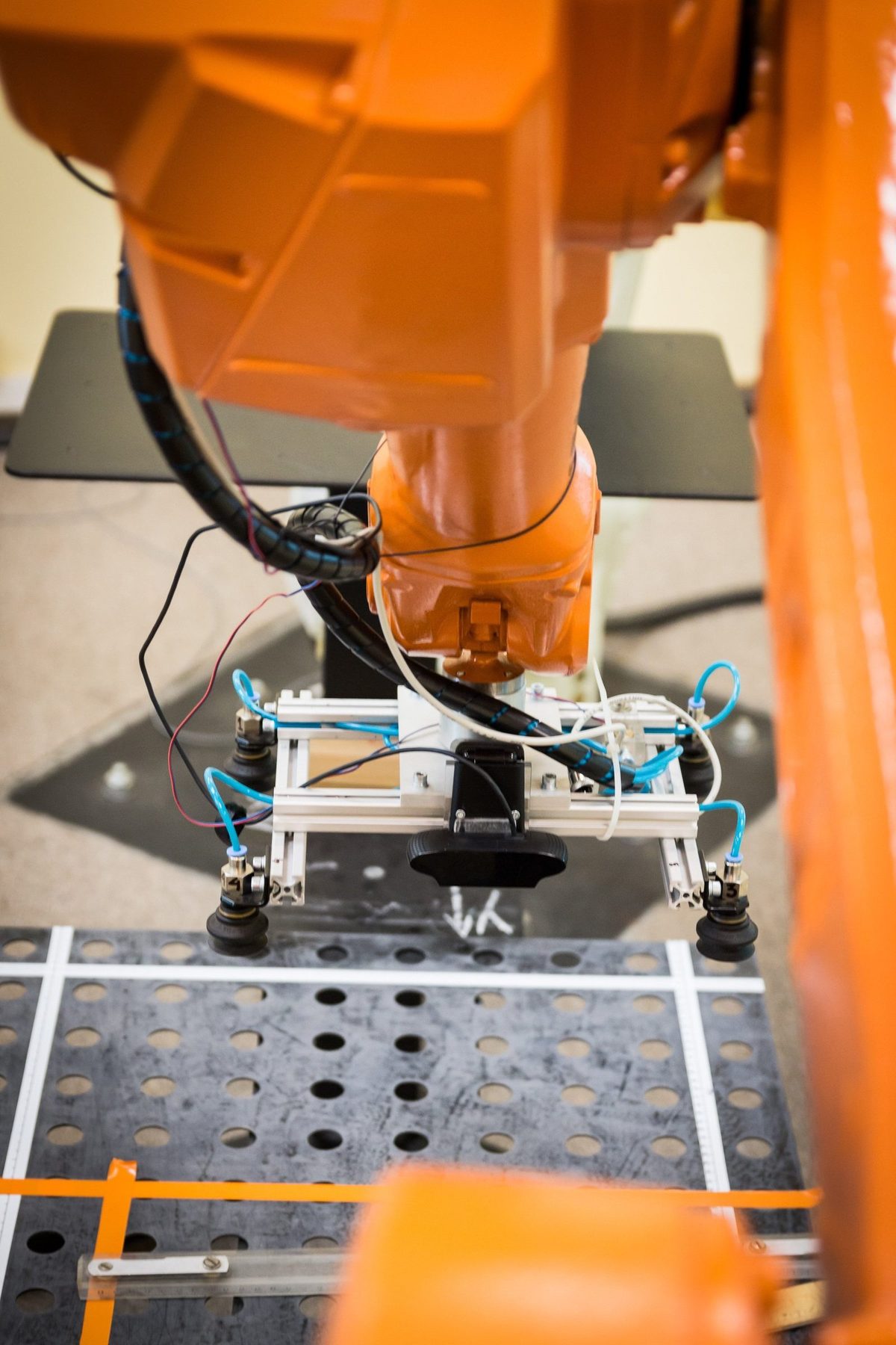 Robotic surface finishing and treatment of a manufactured part